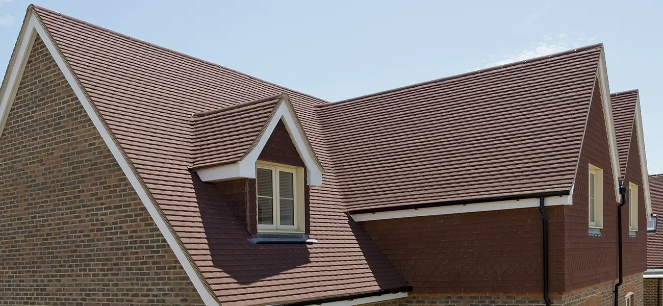 Completed pitched tiled roof with dormer windows